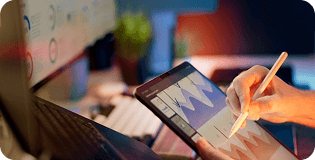 Man drawing with stylus on tablet