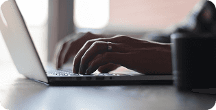 Man typing on laptop